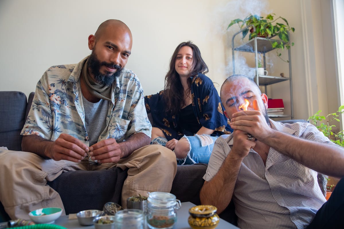 A group of friends gathered with cannabis supplies for a session