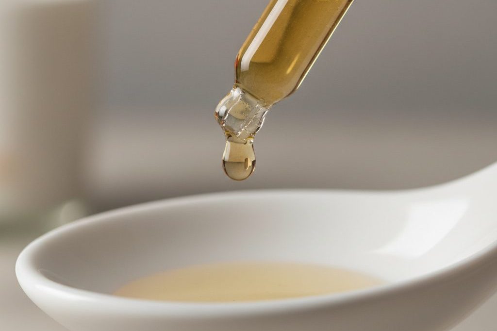 A CBD tincture dropper with measured dose.